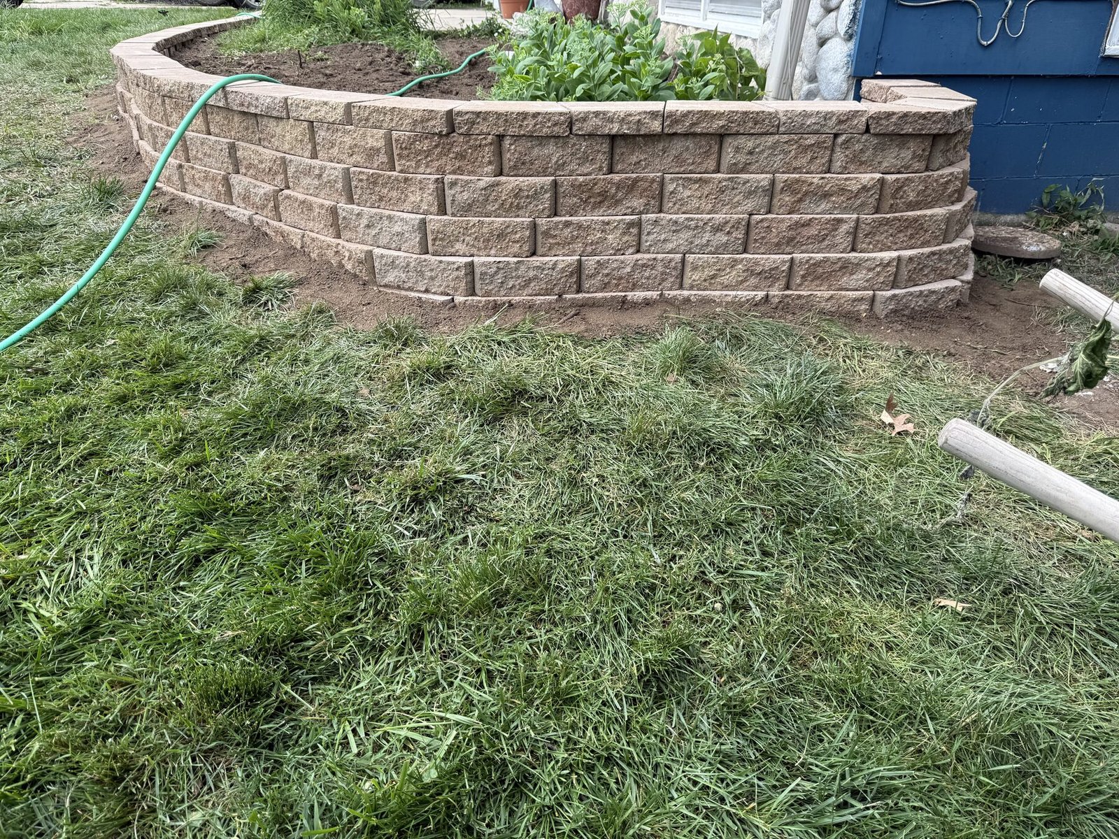 Decorative block wall near a home