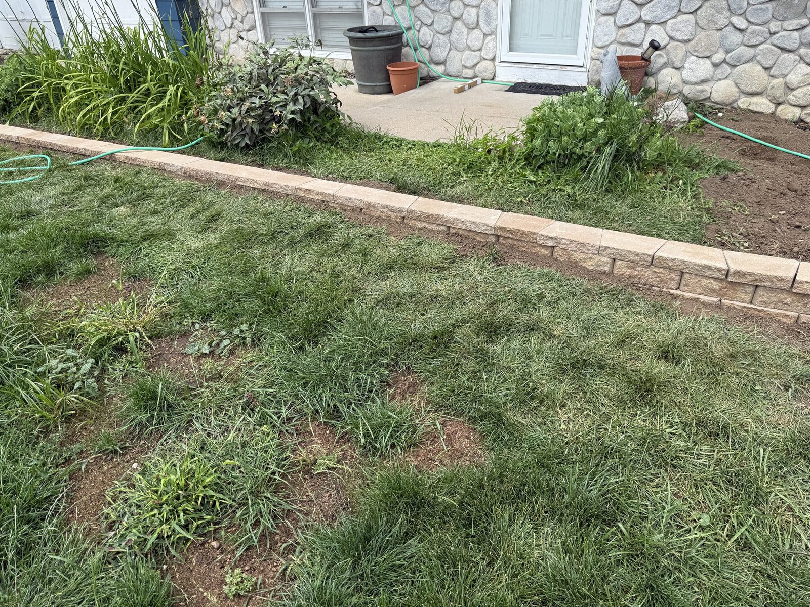 Finished landscape wall along the front of a home